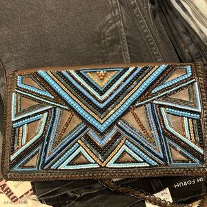 Buba London brown leather beaded clutch with chain shoulder strap. Barely worn.